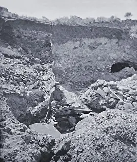 Lcgr2001: Gold prospector working a rocker box near