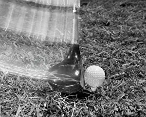 Teeing: Golf Club Hitting Ball Strobe Effect Green Grass