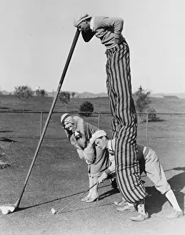 Stilt: Golf game with man on stilts