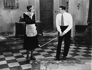 Employer: Golfer golfing with maid