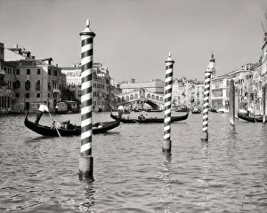 Pali: Two Gondolas Rowing Past Unique Striped Family