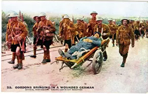 Khaki: Gordon soldiers transporting wounded German, WW1