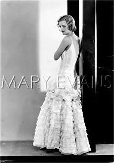 Strappy: GOWN WITH FLOUNCES 1930S