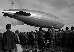 Tailfin: Graf Zeppelin airship hovering above the ground