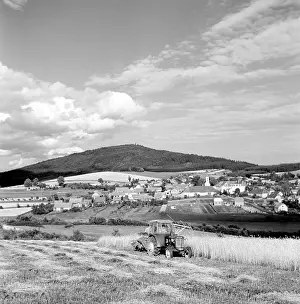 Blanik: Grain harvest - tractor - clouds - Mt. Blanik