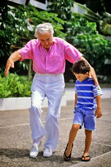 Grandparent: Grandfather Teaching his Grandson a Dance Step