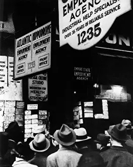 Listings: The Great Depression. Unemployed men crowd around