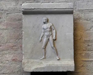 Thrower: Greek art. Relief from a statue base with spear thrower afte