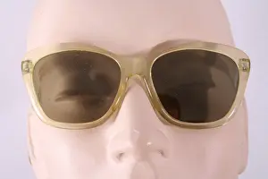 Lenses: Green plastic frame sunglasses with dark green