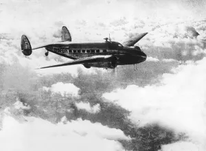 Aerodrome: Greeting card of Chamberlain with Lockheed 14 Super Elec