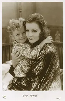 Cuddles: Greta Garbo witha young boy