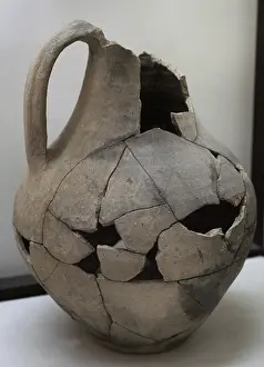 Grid: Grey paste jug with burnished grid decoration