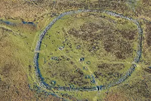Earthwork: Grimspound, partly-enclosed stone hut circle settlement
