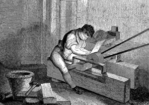 Driven: Grinding needle points, Redditch, England. Grindstone