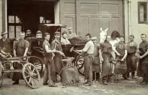 Blacksmithing: Group of 12 workers in a blacksmith workshop