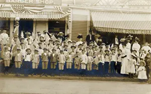 Boaters: Group of adults and children with flags, USA