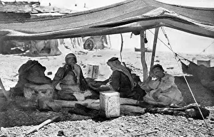 Bedouins: Group of Bedouins in their tent, Holy Land