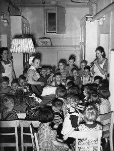 Supervisors: A group of children in an air-raid shelter, 1942