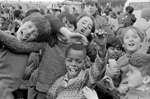 Wythenshawe: Group of children cheering to camera at fete