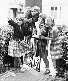 Interested: Group of children at a gate, Balham, SW London