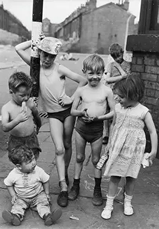Skimpy: Group of children playing in a street