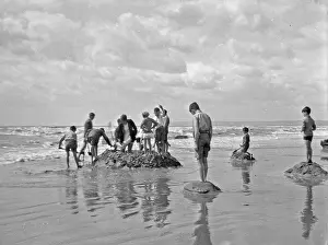 Sandcastle: Group of children at the seaside