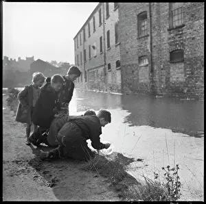 Hanley: A group of children using a goldfish bowl to fish
