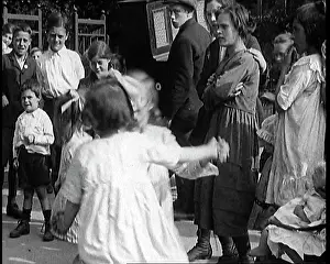 Gurdy: A Group Of Civilian Children Dancing In Front
