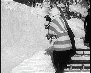 Sledging: A Group Of Civilians Having Fun Cheering Other