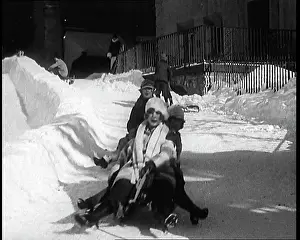 Sledging: A Group Of Civilians Having Fun Sledging Down