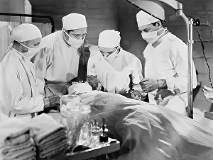 Coworkers: Group of doctors performing surgery