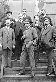 Hatmaking: Group of Edwardian men on garden steps