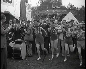 Marquee: A Group of Female Civilians Dancing Outside