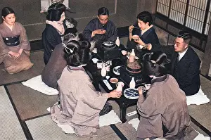 A group of Japanese people eating a meal