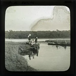 Alex Lambert Lantern Slide Collection: Group of men boating on a lake
