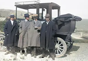 Whit: Group of men by a car