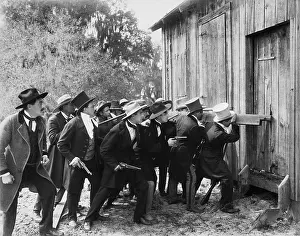 Destructive: Group of men with guns and top hats breaking into a barn