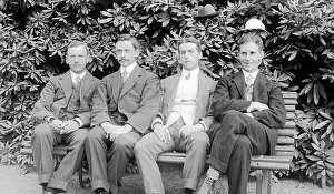 Group of four men with hats