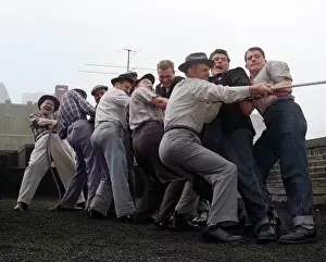 Strongman: One Side Group Men Playing Tug-Of-War Pulling