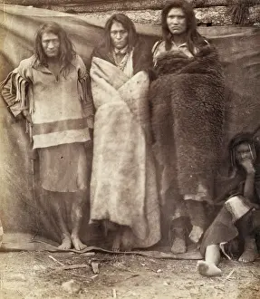 Colville: Group of Native Americans, three standing, one seated on the