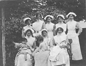 Laps: Group of nurses and children outdoors