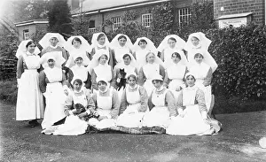 Group of nurses in garden with cats