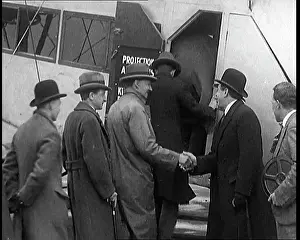 Embarking: A Group of Passengers Embarking Upon A Plane