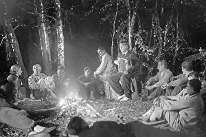 Accordion: Group of people around the camp fire, 1920s