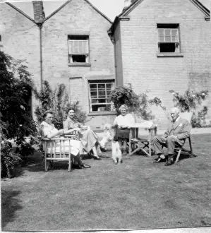 Oaklands: Group of people in a garden, Oaklands