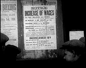 Wages: A Group of People Looking at a Sign. The Sign