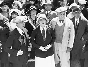 Mustaches: Group of people outside watching