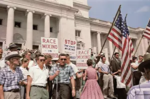 Placard: A group of people rally in Washington, D.C