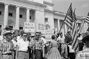 Placard: A group of people rally in Washington, D.C