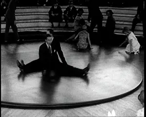 Rotating: A Group of People Sitting on a Large Rotating